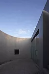Like a Richard Serra sculpture, the building has a simple exterior hiding a complex interior and a form that unfolds as the viewer moves through it. To extend the visitor's experience at this small ga