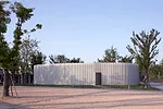 Like a Richard Serra sculpture, the building has a simple exterior hiding a complex interior and a form that unfolds as the viewer moves through it. To extend the visitor's experience at this small ga