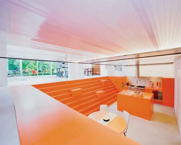 Doepel Strijkers transformed a former ambulance garage into a single-family home. By replacing the back wall with sliding-glass doors, they brought in both daylight and a view of the secluded park, he