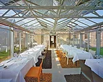 The restaurant is located in what was once a dairy stall on land owned by the former Royal Dutch Gunpowder  Factory in Ouderkerk on the Amstel, the Netherlands. The current owner gained permission to 