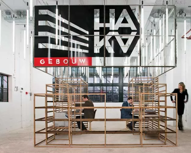 This office is on the ground floor of a 1930s harbor storage and distribution facility in Rotterdam, which stood empty for decades. The facility is now being repurposed as an incubator for startups de