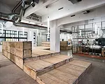 This office is on the ground floor of a 1930s harbor storage and distribution facility in Rotterdam, which stood empty for decades. The facility is now being repurposed as an incubator for startups de