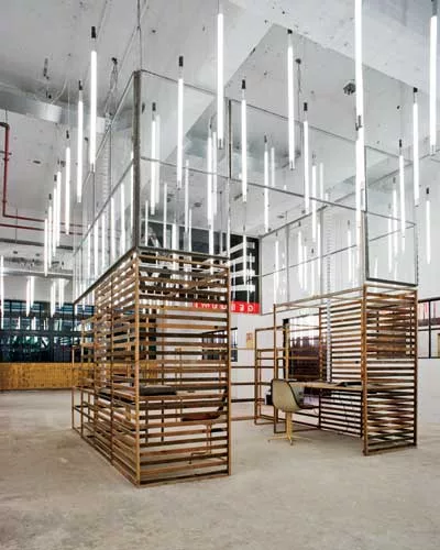 This office is on the ground floor of a 1930s harbor storage and distribution facility in Rotterdam, which stood empty for decades. The facility is now being repurposed as an incubator for startups de