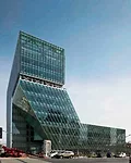 A building for the Korea National Housing Corporation in Jeonju, South Korea, consists of offices (220,000 square feet) and a cultural center (80,000 square feet). Rather than restricting the cultural