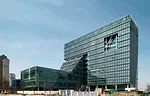 A building for the Korea National Housing Corporation in Jeonju, South Korea, consists of offices (220,000 square feet) and a cultural center (80,000 square feet). Rather than restricting the cultural