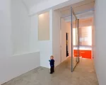 Doepel Strijkers transformed a former ambulance garage into a single-family home. By replacing the back wall with sliding-glass doors, they brought in both daylight and a view of the secluded park, he