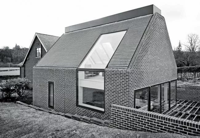In adding to a simple house in Strathblane, Scotland, Lee and Pert followed the pattern of local farms that expand by erecting new buildings wherever they are needed. The architects echoed the form of