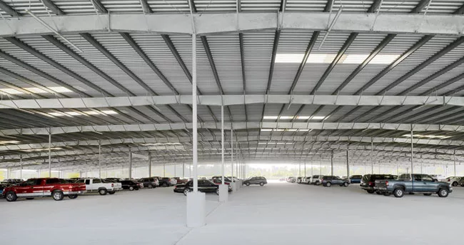 This parking facility for a private commercial extension of George Bush Intercontinental Airport in Houston was the firm's first commission. The aerial montage above depicts the project as it would be