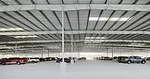 This parking facility for a private commercial extension of George Bush Intercontinental Airport in Houston was the firm's first commission. The aerial montage above depicts the project as it would be