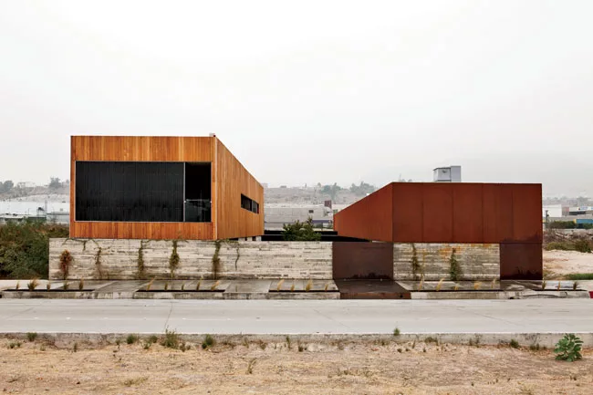 For a 9,622-square-foot cooking school in Tijuana, Gracia designed a pair of structures facing each other on a 10,760-square-foot site. A wide interior pedestrian street separates the two buildings an