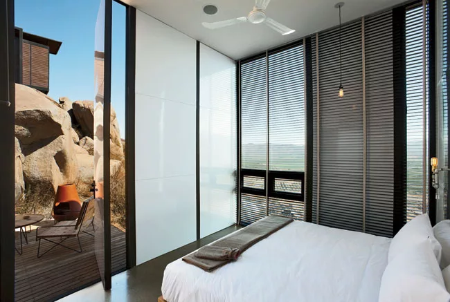 This hotel, operated by Grupo Habita, the boutique-hotel company based in Mexico City, is composed of 20 Minimalist guest structures perched on a hillside above a vineyard. Gracia designed the rusty-b