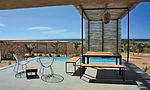 With two vacation cottages completed in 2006 (one for the client, the second to rent), Gracia staggered the one-story structures on the 50,000-square-foot desert site so each would have expansive view