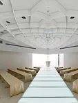 Designed specifically for weddings, Forest Chapel appears as an abstract white box amid a garden site in Gunma prefecture.  Leaving its plain wrapping outside, the modest building comes into full bloo