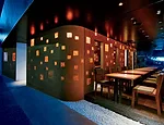 Ogawa's first project after opening his firm, Kimukatsu is a restaurant in central Tokyo. Hired to design the interior and facade, Ogawa called upon a traditional mason to cover the shopfront with a t