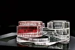 The Access and Services Building stacks 14 programmatic elements on five independent vertical cores. The elliptical shapes overlap within the circular building envelope. The firm won a 2008 competitio