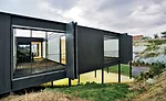 For protection from sea winds, the architects excavated a sunken garden on the southern exposure of this lot on the Cantabria coast and built the house over it. Patios for light and circulation slice 
