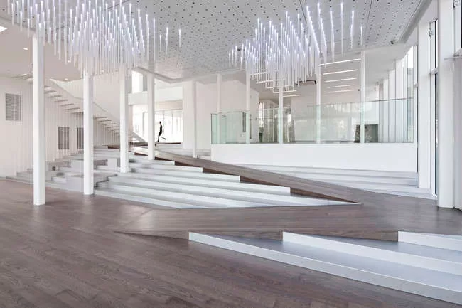 A view inside the White Block Gallery. LED-lit plexi-rods, in the style of SsD's 'Cloud' installation, hang from the ceiling in this entrance hall.