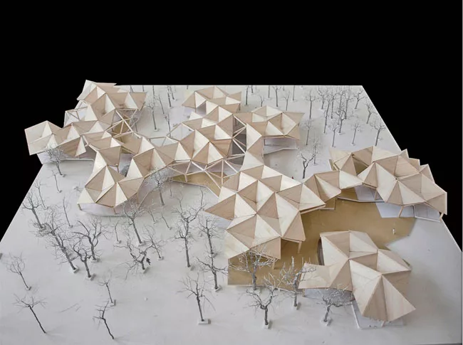 Tree-shaped columns with cantilevered beams form a rambling structure that zigzags between real trees in a riverside Beijing park. The project will be built in phases, so TAO designed a grid that can