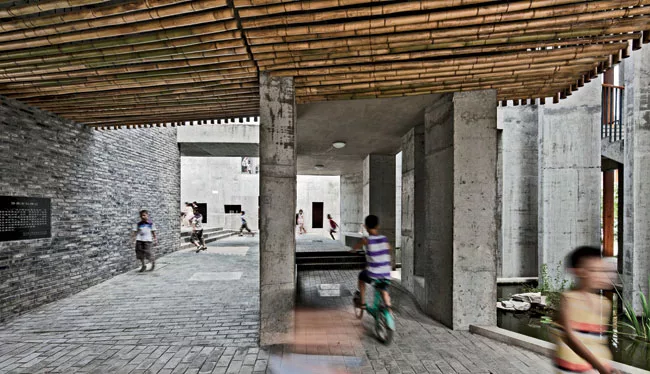 'We're trying to do something different, to challenge the clich'd educational approach,' says Hua. TAO's gathering of buildings and outdoor spaces allows children to pursue individual activities in ad