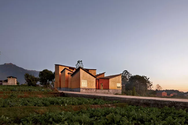 TAO designed this museum in Yunnan province as a cluster of volumes, echoing the ad hoc pattern of buildings in the adjacent village of Gaoligong. The museum's timber-framed buildings use nail-free su