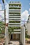 While their city is becoming increasingly dense and polluted, residents of Ho Chi Minh City still love their plants and trees. So Vo designed this 13-foot-wide private house with cantilevered planters