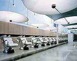 The project that launched Nagayama's career, Afloat-f is a two-story hair and nail salon located in Tokyo's Omotesando neighborhood. Illuminated from below by halogen lamps, aluminum satellite dishes 