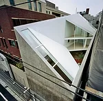 Faced with a commission to design a house for a family of four on a long, narrow site in a densely built neighborhood in central Tokyo, Nagayama had to figure out how to bring daylight inside without 