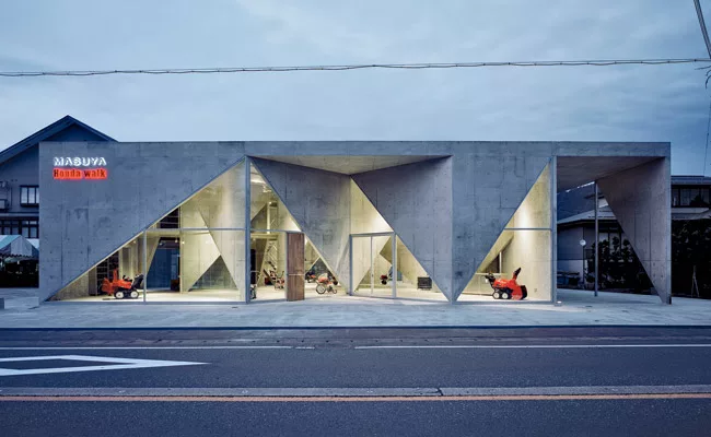 An unlikely pairing of avant-garde architecture and agricultural machinery, Masuya is a showroom for tractors and snow blowers located in rural Niigata Prefecture. Completed in 2005, the concrete buil
