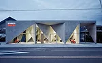 An unlikely pairing of avant-garde architecture and agricultural machinery, Masuya is a showroom for tractors and snow blowers located in rural Niigata Prefecture. Completed in 2005, the concrete buil