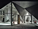 An unlikely pairing of avant-garde architecture and agricultural machinery, Masuya is a showroom for tractors and snow blowers located in rural Niigata Prefecture. Completed in 2005, the concrete buil
