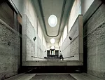 This intervention occupies the basement of a Neoclassical loggia in Madrid. Collaborating with Jes&uacute;s Aparicio, Elorza removed a portion of a thick floor slab to create a double-height auditoriu