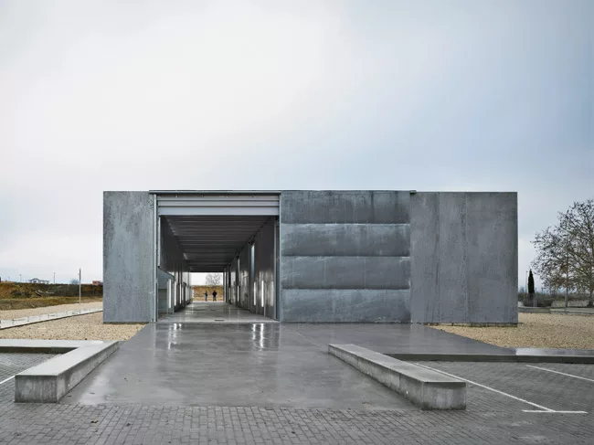 At this windowless facility in Madrid where scientists handle dangerous substances, narrow patios separate four labs, while a vehicular service corridor runs the length of the building. Elorza enclose