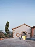 Elorza converted this deconsecrated chapel in Jarandilla de la Vera into a center for cultural activities. He lined its interior with a tube of structural concrete'floor, walls, and pitched ceiling'to