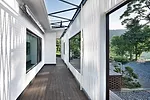 The owner of a Seoul design company owned an ugly brick house in the mountains in Namhae county, where he liked to escape. He decided to make it more welcoming, so he hired JOHO to remake the building