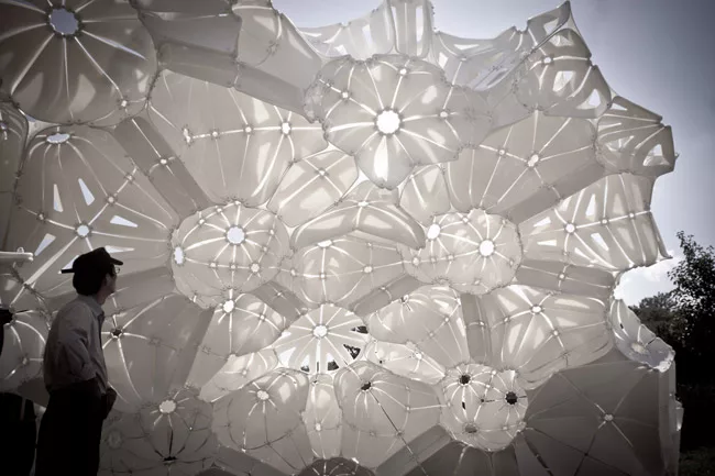 Plasti(k) is made of 150 4-by-8-foot sheets of polyethylene held together by more than 1,300 bolts. Washington University architecture students helped fabricate and assemble the piece, which was insta