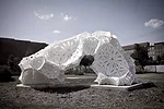Plasti(k) is made of 150 4-by-8-foot sheets of polyethylene held together by more than 1,300 bolts. Washington University architecture students helped fabricate and assemble the piece, which was insta