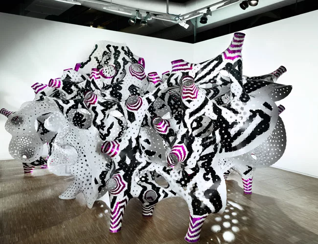 Y/Surf/Structure, part of the permanent collection of the Centre Pompidou, has more than 7,000 parts assembled with 32,000 rivets. The perforations here, and in other works by TheVeryMany, make the in