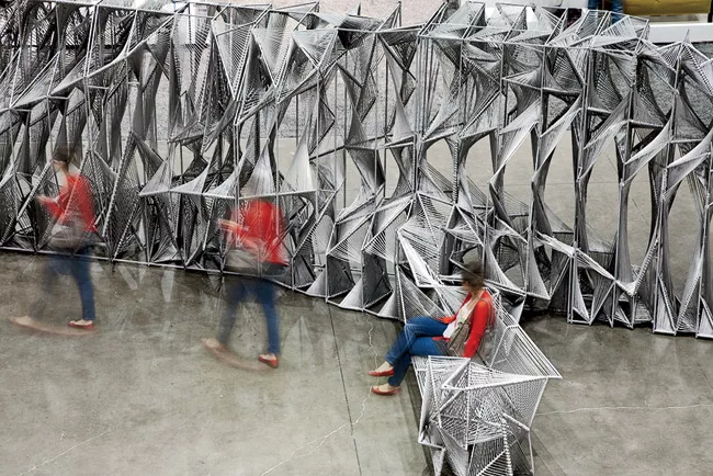 This 21-foot-long installation in Los Angeles, made of rope strung across steel framing, forms an optical illusion. Look at it straight on and you see a repeating, legible pattern. But move around it