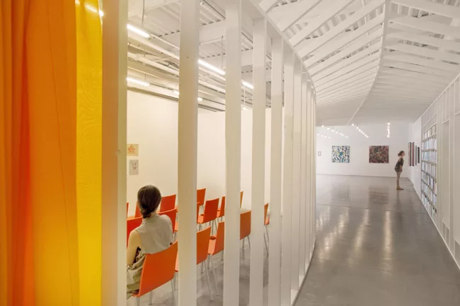 Para transformed the 4,500-square-foot ground floor of a four-story warehouse in west Syracuse, New York, into a Latino cultural center. Movable fabric curtains, rather than traditional walls, divide 