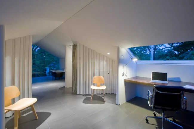 For the firm&rsquo;s first project in Syracuse, New York, Para converted a 400-square-foot residential attic into a guest bedroom and writing studio. The architects inserted a window wall opposite a b