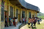 This school was one of the firm&rsquo;s earliest projects. Integrated into the surrounding landscape of farming terraces, it features a topography of steps connecting a basketball court to an open roo