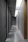 Daylight floods a corridor, as it does many of the other naturally ventilated interiors.