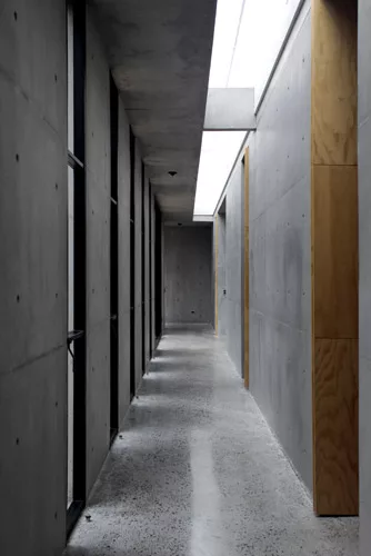 Daylight floods a corridor, as it does many of the other naturally ventilated interiors.