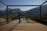 Designed as a refuge for its city-dweller clients, the house also functions as an observatory. Minimal steel railings and structure surround the rooftop deck, providing places to hang a hammock as wel