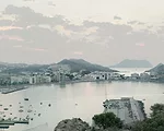 For a town on Spain's Mediterranean coast, the architects created a compact volume to minimize its occupation of the waterfront, and to create a point of reference in the landscape. The concave walls,