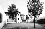 Planned for completion in 2017, this competition-winning project expands an existing historic building—Casa Ragen, in Brunico, Italy—and retains the town's urban fabric with low, wall-like