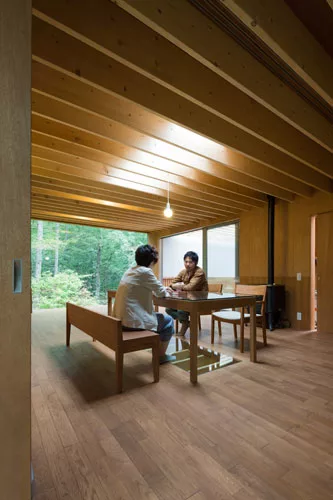A tree house to top all others, this is a weekend home in densely wooded Nagano Prefecture, Japan. Perched on 21-foot-high columns evoking the surrounding tree trunks, the single-story home contains a