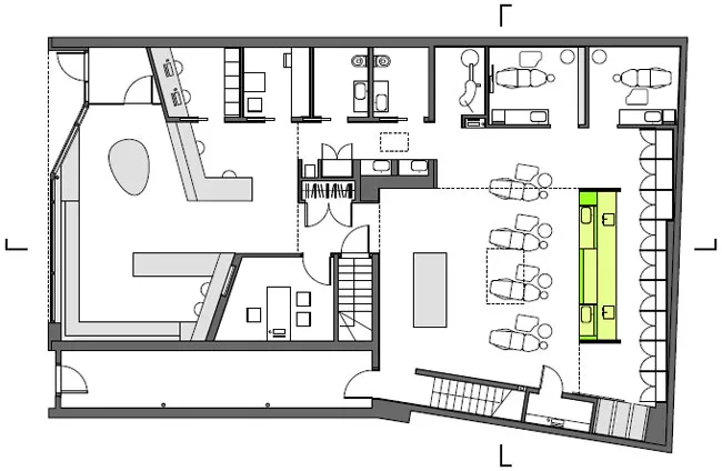 The wall separates the patient treatment space from the lab/sterilization area in back.
