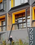 A new 12,000-square-foot, 3&frac12;-story apartment complex on the waterfront in East Boston has a vertical garden growing along a mesh screen on the facade. 