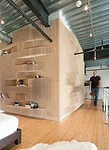 Merge&rsquo;s interior projects often involve the repetition of simple objects. For an installation in a private loft, the firm created an undulating pegboard wall out of 42,000 wooden dowels. It was 